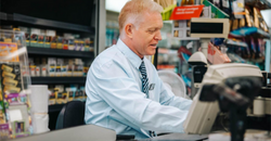 zebra---a-retail-store-manager-works-a-point-of-sale-desk